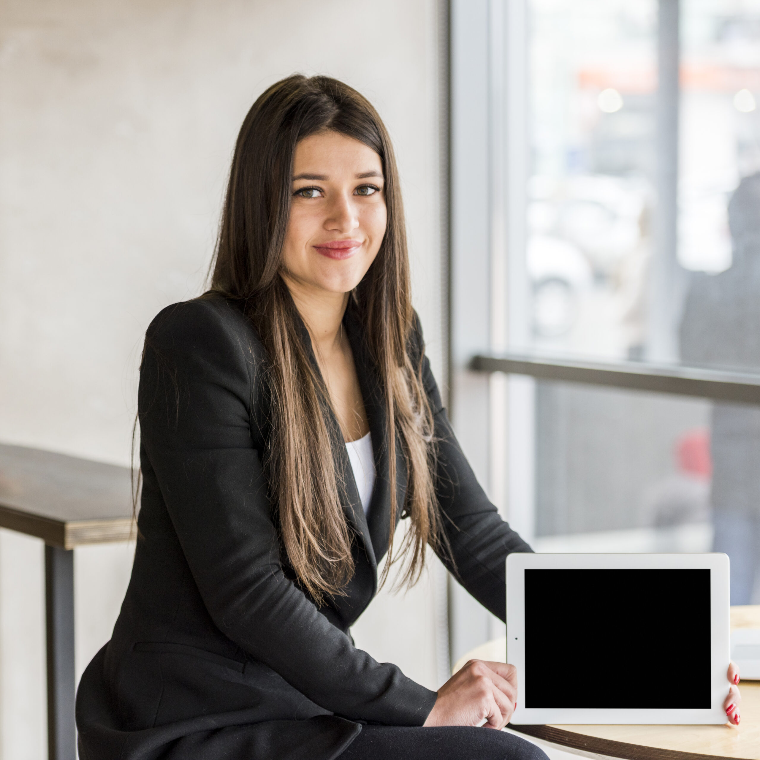 brunette-businesswoman-showing-her-tablet